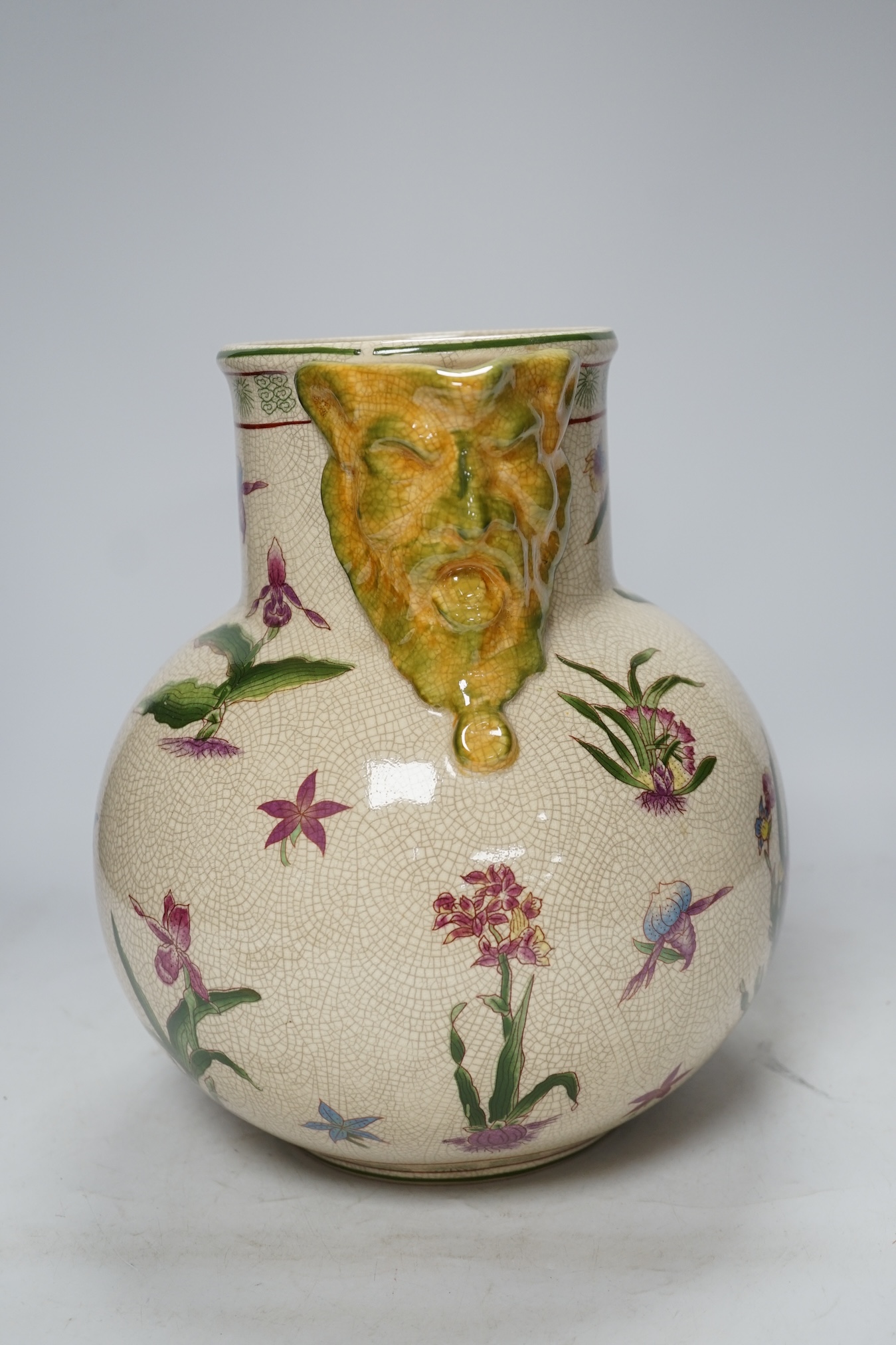 From the Studio of Fred Cuming. A large crackle glaze pottery mask jug, 29cm high. Condition - good